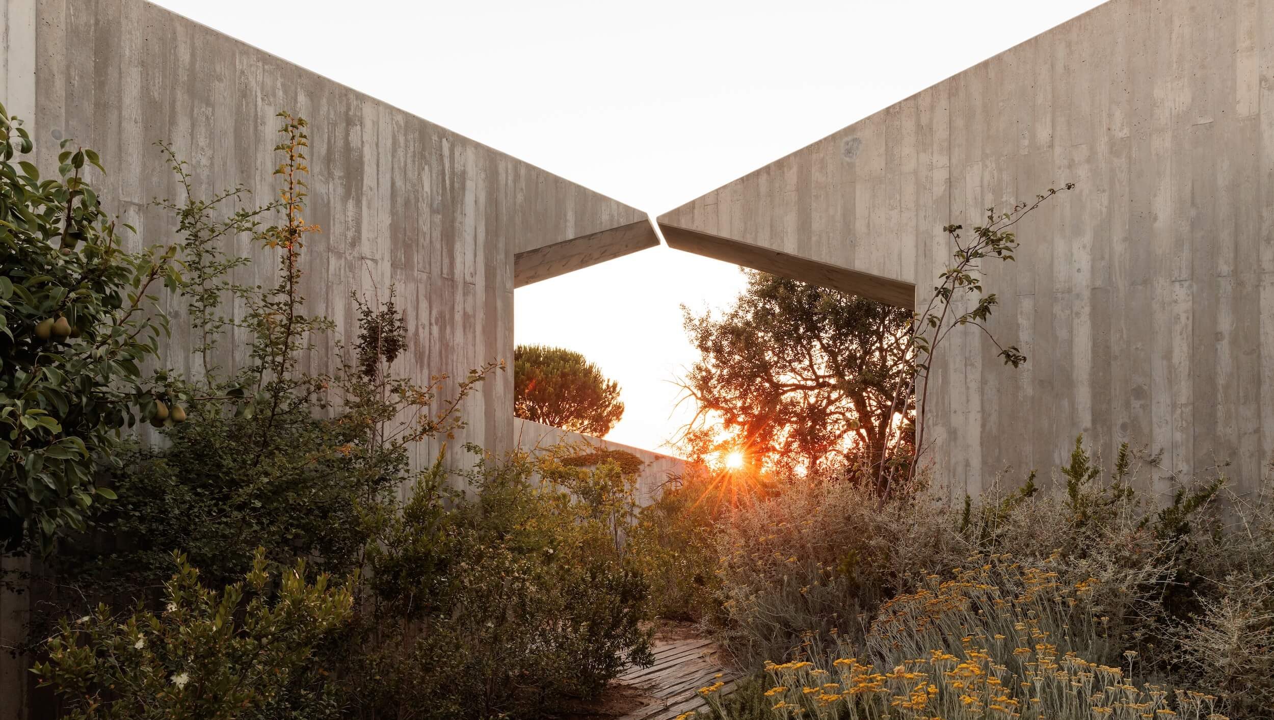 A home away from home, the four contemporary villas at Pa.te.os were designed by Portugese architect Manuel Aires Mateus.